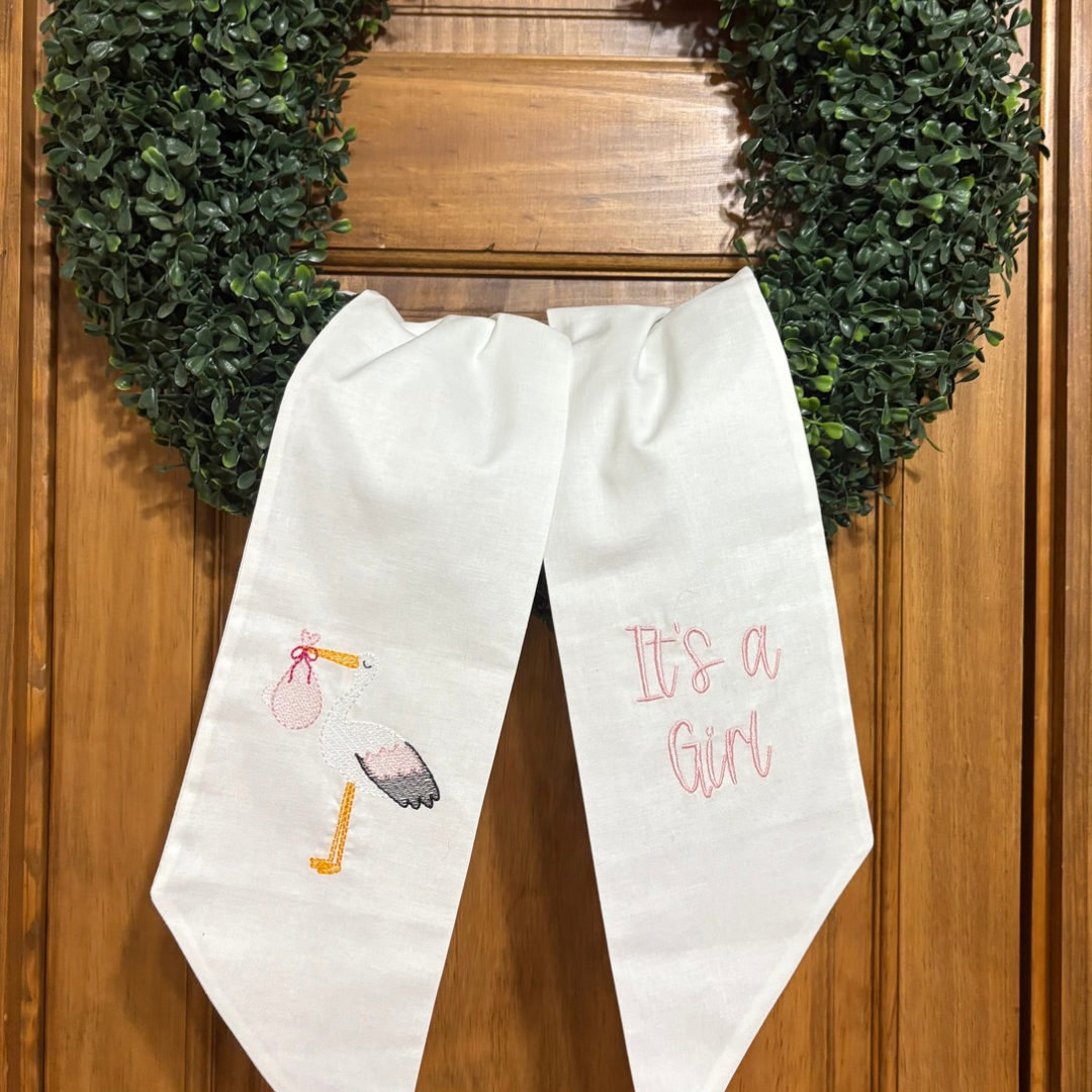 It's a Girl with Stork Wreath Sash